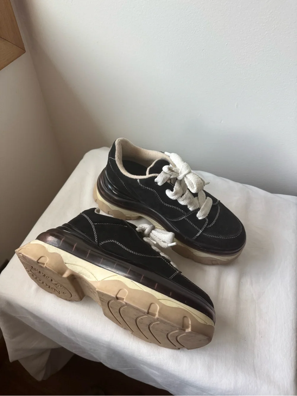 Steve Madden Evolved Sneaker in black with a chunky cream and tan platforms 9.5